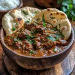 Slow Cooker Indian Beef Curry served with naan and rice