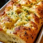 Delicious Italian Herb and Cheese Bread – A Comfort Bake 8 Golden Italian herb and cheese bread loaf with melted mozzarella and herbs.
