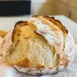 Artisan Bread Recipe – Bake Perfect Loaves 8 Golden crusty artisan bread on a wooden board